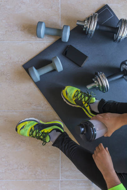 istock Dumbbell and mat training at home, 1049812570