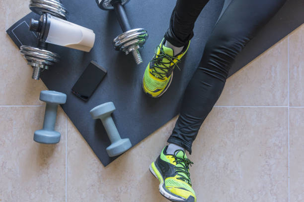 istock Dumbbell and mat training at home, 1049812600