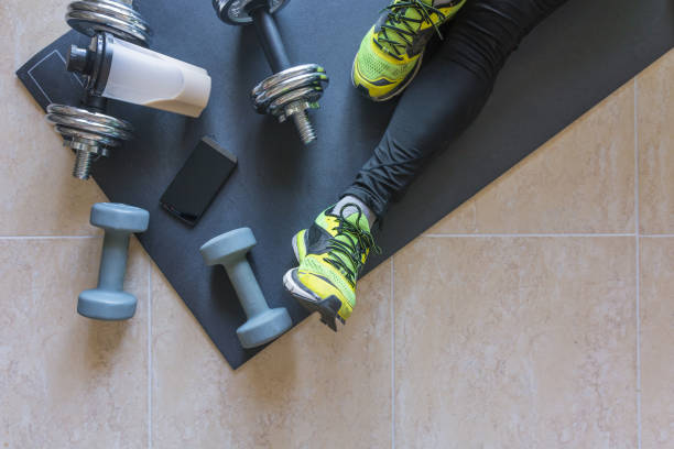 istock Dumbbell and mat training at home, 1049812602