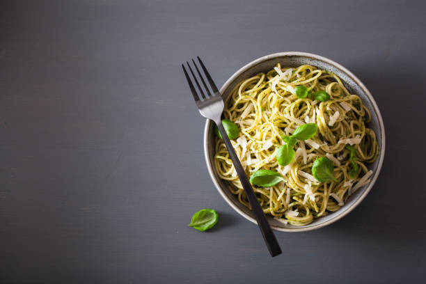 istock spaghetti pasta with avocado basil pesto sauce 1049812952