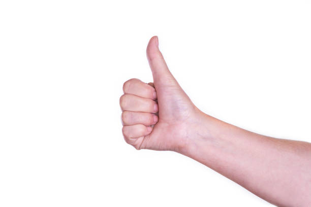 istock The thumbs up hand sign isolated on white background. Approval concept 1049819464