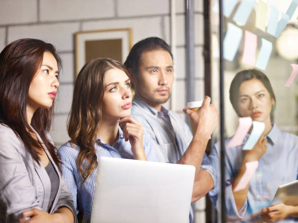 istock young asian corporate executives working together in office 1049820074