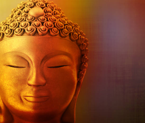 istock Face of a buddha on a golden background 1049827202