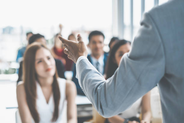 Speaker talking in seminar with many of audiences for business meeting for key of success Speaker talking in seminar with many of audiences for business meeting for key of success workshop stock pictures, royalty-free photos & images