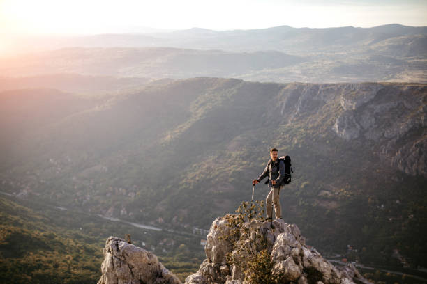 istock Young man Standing at Edge in Peak District 1049828188