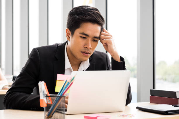 istock Asian Businessman is getting stress about work at the office. 1049832006