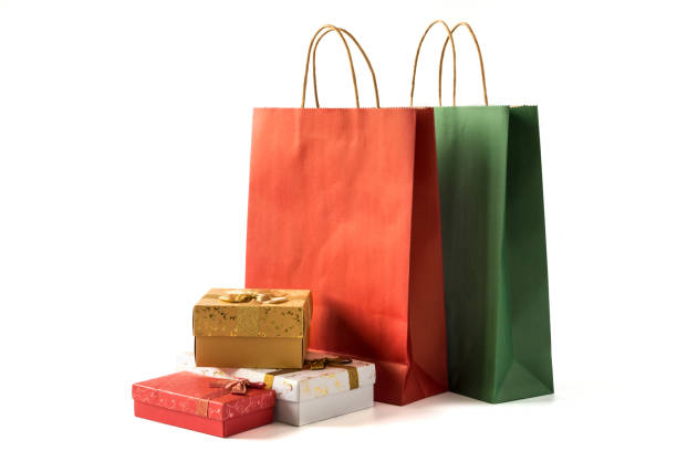 istock Colourful paper shopping bags with gift boxes on white background 1049832010