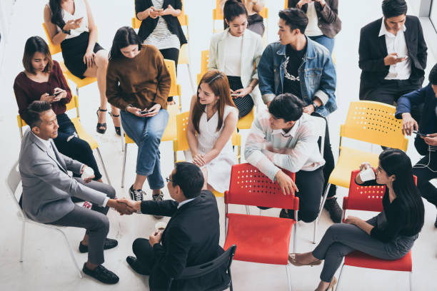 istock Group of people are talking together while taking a coffee break from seminar 1049836892