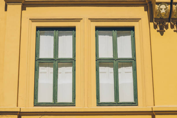 istock old yellow house with sculptures and windows in oslo, norway, full frame view 1049844524