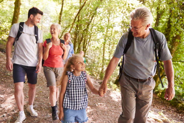 istock Multi Generation Family Enjoying Walk Along Woodland Path Together 1049857140
