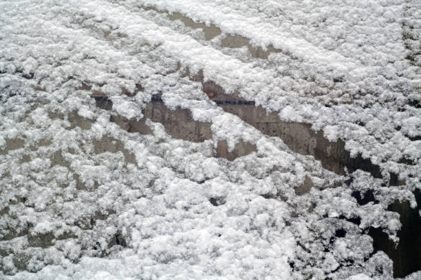 istock Plastic greenhouse covered with snow. 1049857178
