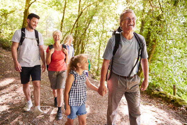istock Multi Generation Family Enjoying Walk Along Woodland Path Together 1049857188