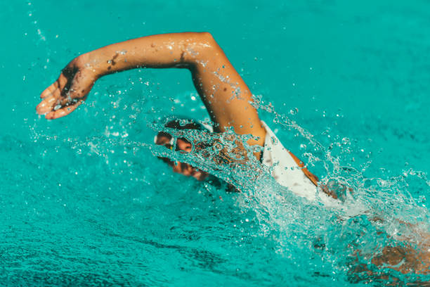istock Female Athlete Swimming In Pool 1049858966