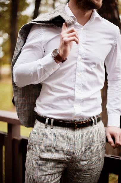 istock Midsection Of Businessman Wearing Suit In Forest 1049862332