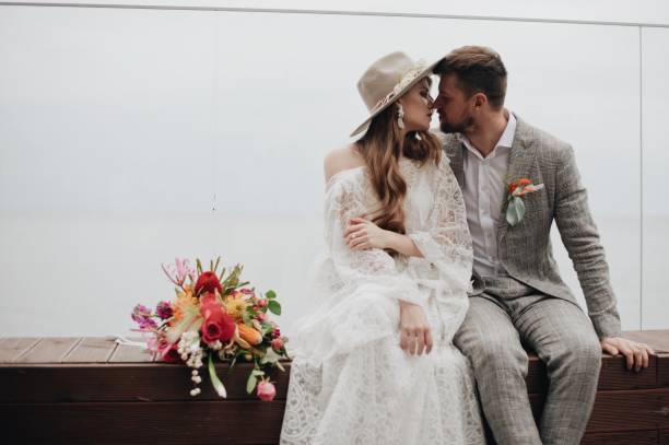 istock Bride And Bridegroom Sitting On Seat 1049863108