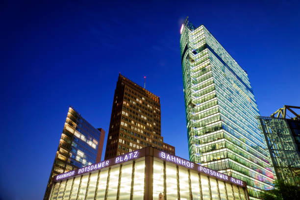 istock Illuminated high-rise architecture at Potsdamer Platz in Berlin at night 1049863236