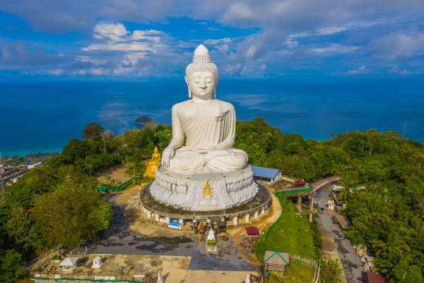 istock areial view white cloud in blue sky at Phuket big Buddha. 1049869356
