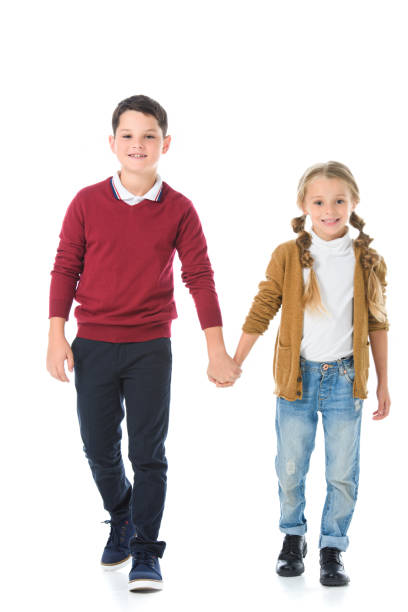 istock happy siblings holding hands isolated on white 1049869966