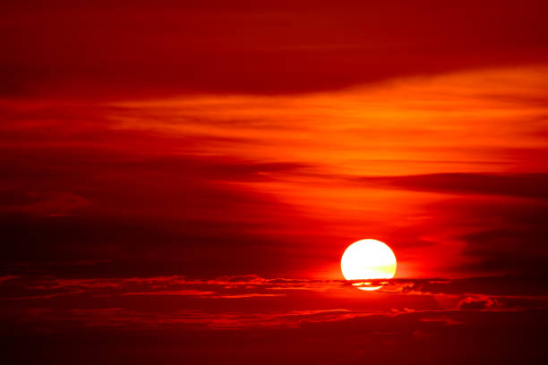 istock last light of sunset on  sky cloud ray around sun 1049873760