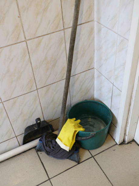 istock cleaning bucket and mop 1049876396