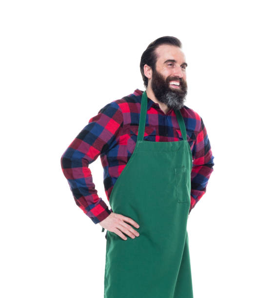 istock Man wearing green apron 1049880442