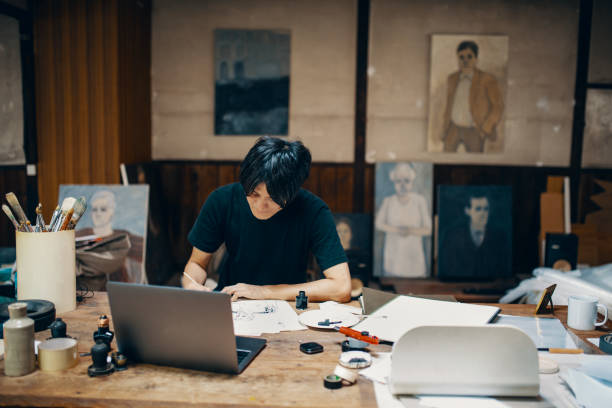 istock Mature male artist sketching ideas in his studio 1049885014