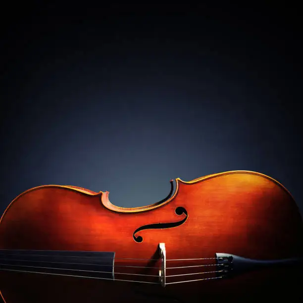 Photo of Cello on black background with copy space for music album or cd cover