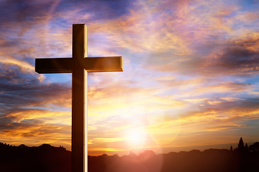Crucifix cross at sunset background, crucifixion of Jesus Christ