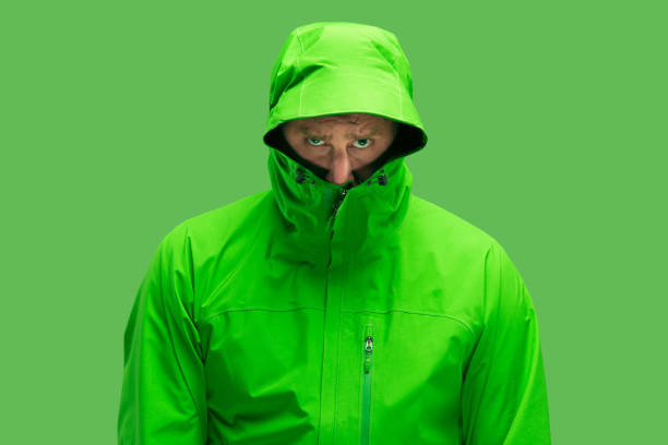 istock handsome bearded young man isolated on green 1049888222