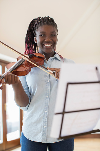 Portrait Of Female High School Student Playing Violin