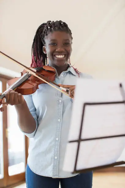 Photo of Portrait Of Female High School Student Playing Violin