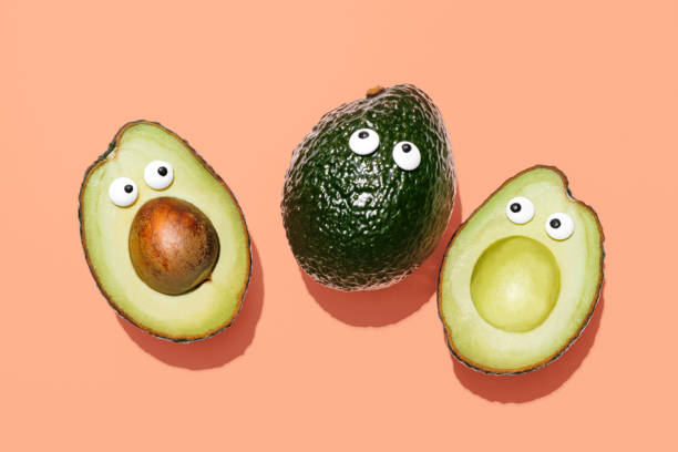 avocado divertente - superfood avocado fruit vegetable foto e immagini stock