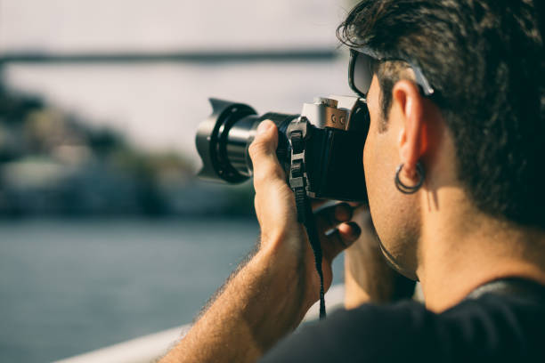 istock Photographer taking photo of bridge 1049890930