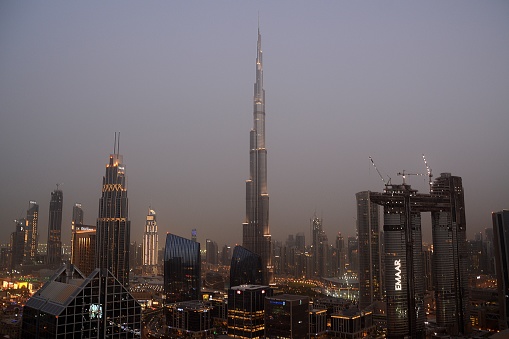 Dubai ultra modern skyline at dusk with the Burj Khalifa, the tallest building in the world. United Arab Emirates.