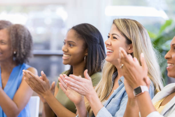 istock Group of women applauding 1049891284