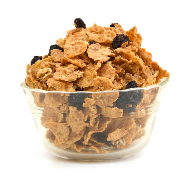 bran and raisin cereal in a bowl , top view bran and raisin cereal in a bowl , top view bran stock pictures, royalty-free photos & images