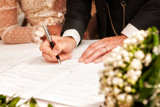 istock Hands signing during the wedding 1049904728