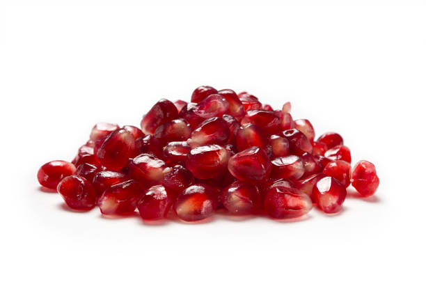 Fruit pomegranate seeds isolated on a white background side view closeup. stock photo