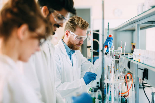 istock Group of chemistry students working in laboratory 1049913460