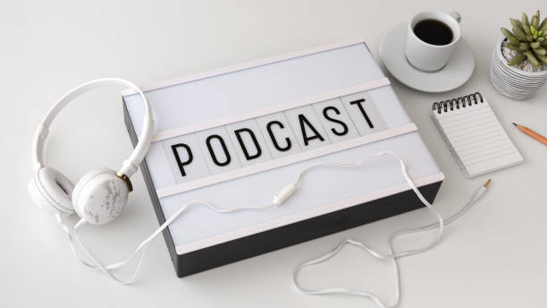 istock Podcast concept with headphones on white background 1049913664