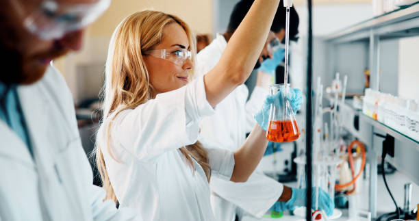 istock Young students of chemistry working in laboratory 1049913974