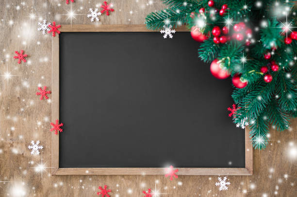 istock Empty blackboard with christmas decoration, fir branches. 1049916610