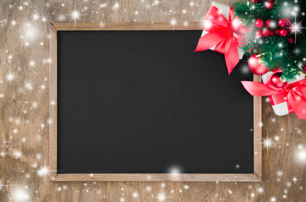istock Empty blackboard with christmas decoration, red gift box, fir branches. 1049916638