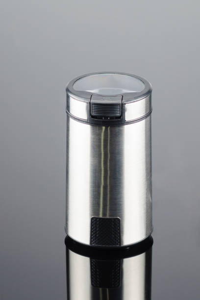 istock Coffee grinder on the grey mirror background 1049919858