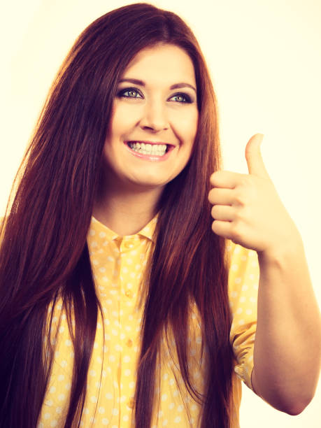 istock Cheerful woman showing thumb up 1049932266