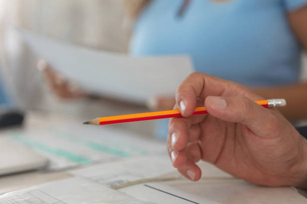 istock Businessman holding pencil 1049932378