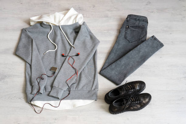 istock Teen clothing set: grey sweatshirt, black jeans and boots in military style 1049932512