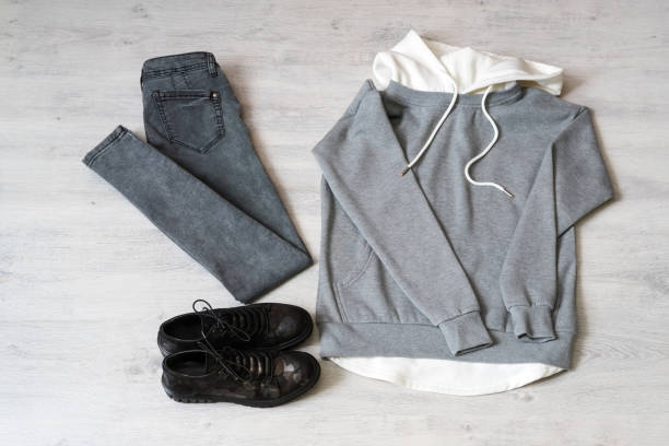 istock Teen clothing set: grey sweatshirt, black jeans and boots in military style 1049932572
