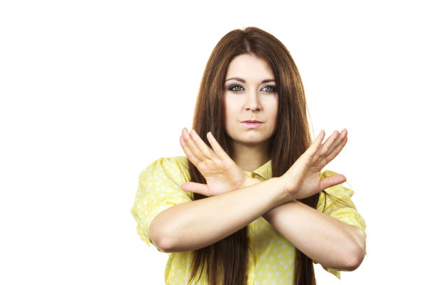 istock Assertive woman showing stop gesture 1049932578