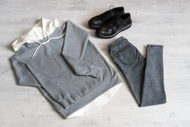 istock Teen clothing set: grey sweatshirt, black jeans and boots in military style 1049932616